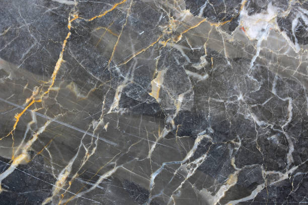 istock Gold yellow and white patterned natural of dark gray marble pattern texture and background for design product. 1180727262