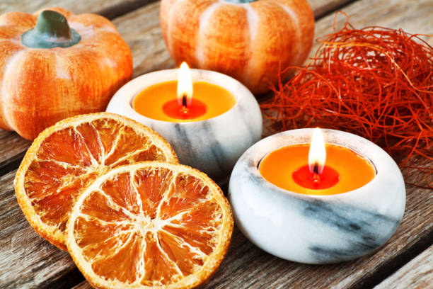 istock Autumn decorations with candles and pumpkins 1180730012