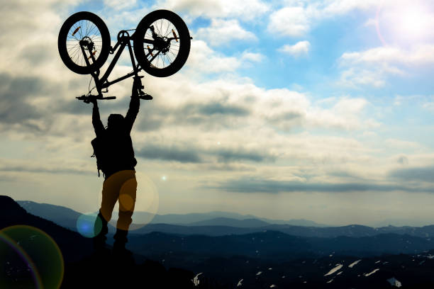 istock bicycle adventure in dangerous and wild mountains 1180730343