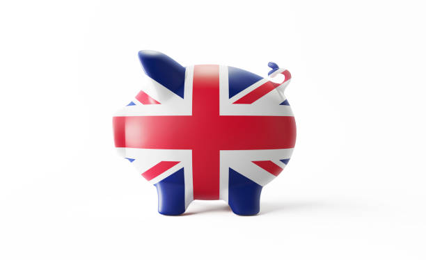 banco piggy textured com a bandeira britânica isolada no fundo branco - british flag currency banking uk - fotografias e filmes do acervo