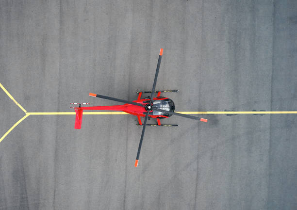 istock red helicopter on the runway 1180733781
