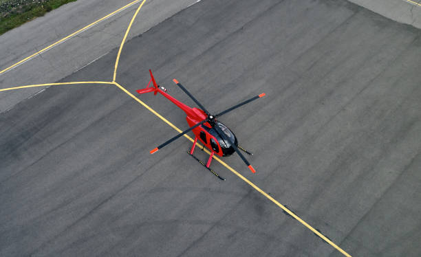 istock red helicopter on the runway 1180733833