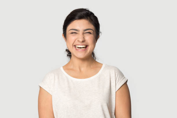 istock Overjoyed indian girl laugh posing on grey background 1180735706