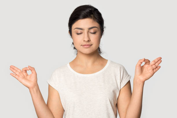istock Peaceful indian girl posing meditate with mudra hands 1180735898