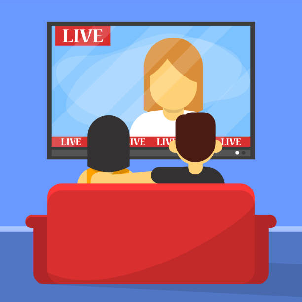 istock Family couple watch TV sitting on the sofa back view 1180739669