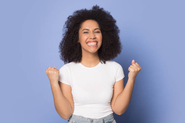 istock Overjoyed african American girl feel euphoric with win 1180739784