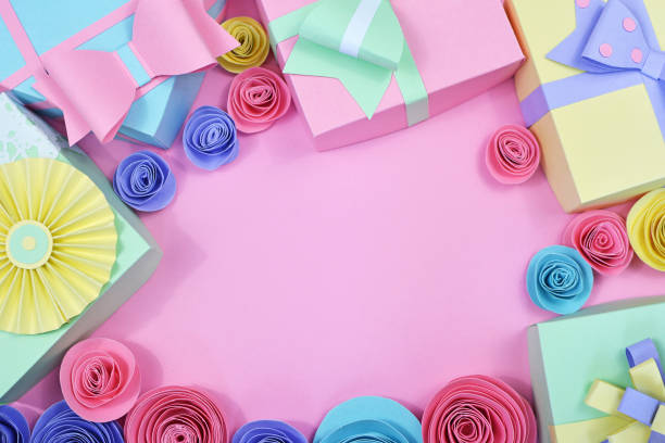 Flat Lay Background With Pastel Colored Paper Craft Gift Boxes With Ribbons  And Paper Roses Framing Copy Space In Middle Of Pink Background Stock Photo  - Download Image Now - iStock