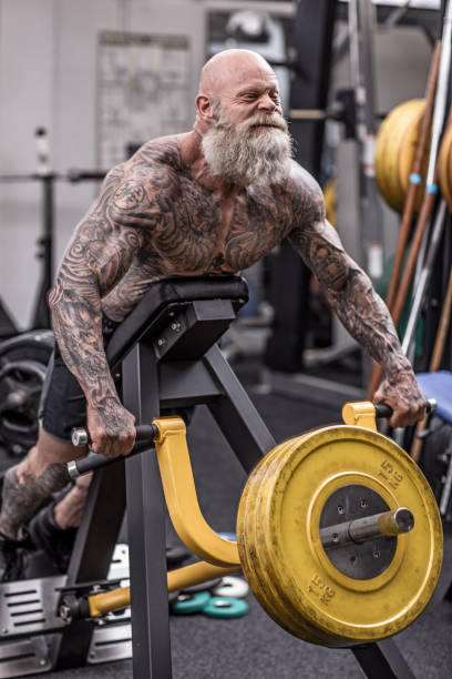 istock Tattooed Senior Man During Gym Workout 1180744004