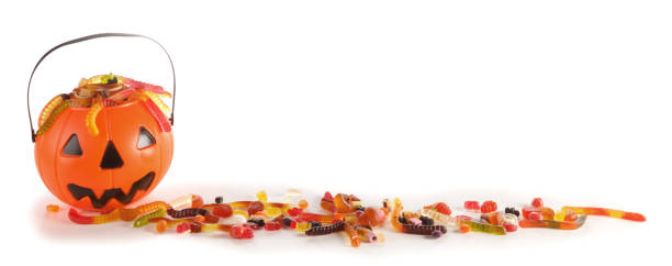 istock Halloween candies in Jack-O-Lantern bag 1180744284