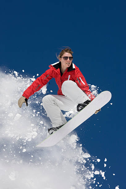 istock Awesome Snowboard Jump Against Powder Snow 118074519
