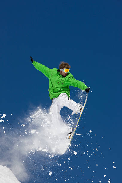 istock Snowboarder In Action Against Blue Sky 118074869