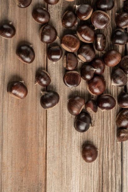 istock ripe and fresh chestnuts on wooden table with copy space 1180751560
