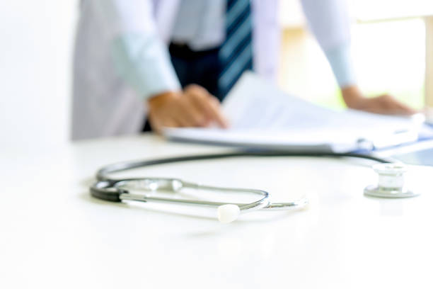 Doctor stand on the table with x ray film , Doctor stand on the table with x ray film ,brain ct scan generic description stock pictures, royalty-free photos & images