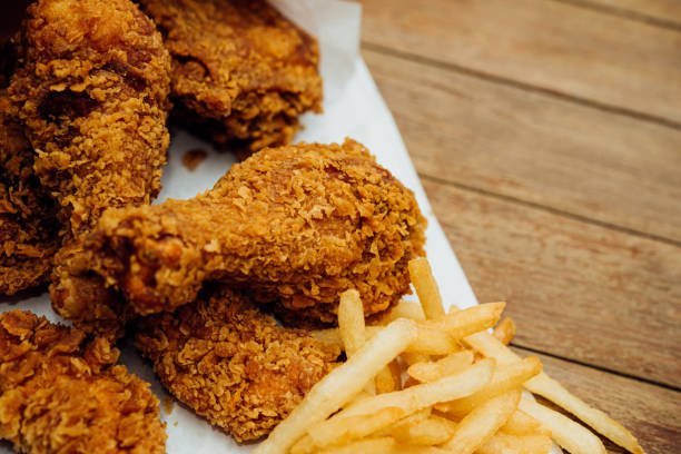 istock Fried chicken and French fries or chips (potato) 1180753487