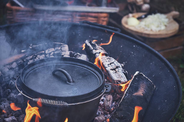 istock Cooking Chili Con Carne in Dutch Oven over Logfire 1180754542