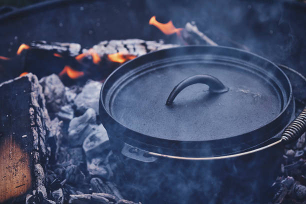 istock Cooking Chili Con Carne in Dutch Oven over Logfire 1180754553
