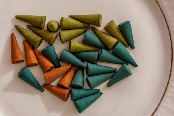 istock Cone incenses on a porcelain plate 1180754835