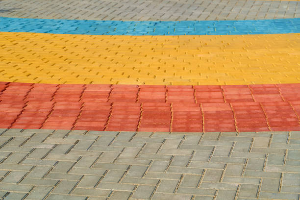 istock yellow, red and blue paving tiles for background or texture 1180754918