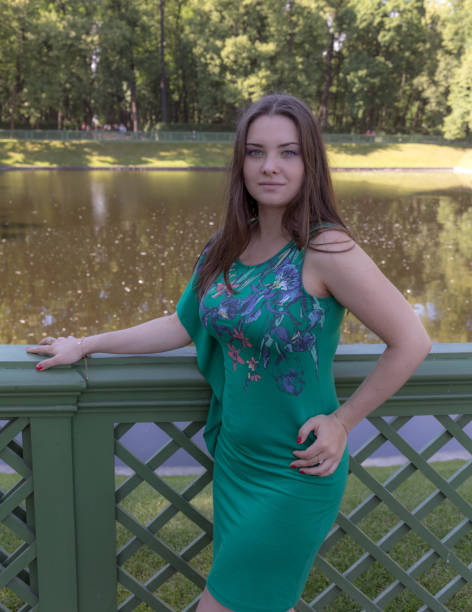 istock girl in a summer park 1180754976