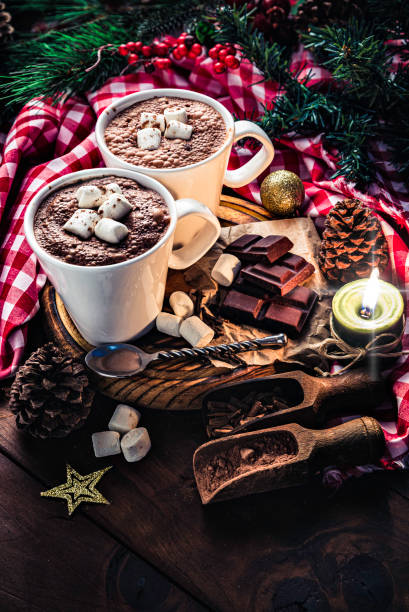 istock Christmas table setup with homemade chocolate mug, marshmallows on rustic table 1180755507
