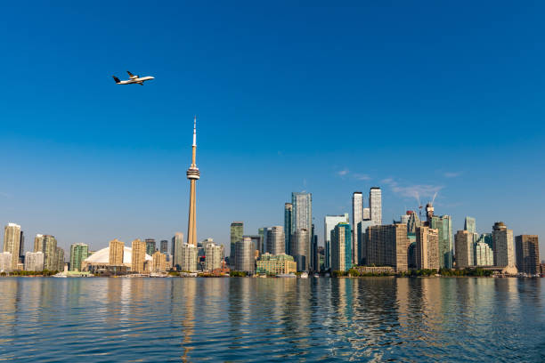 istock Aeroplane flying past the Toronto skyline over the harbor 1180758343
