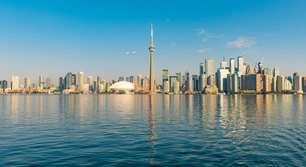istock Aeroplane flying past the Toronto skyline over the harbor 1180758344