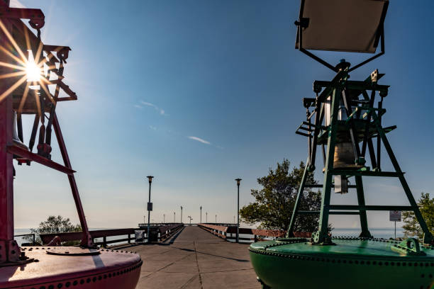 View down Toronto Pier on a sunny day with old buoys