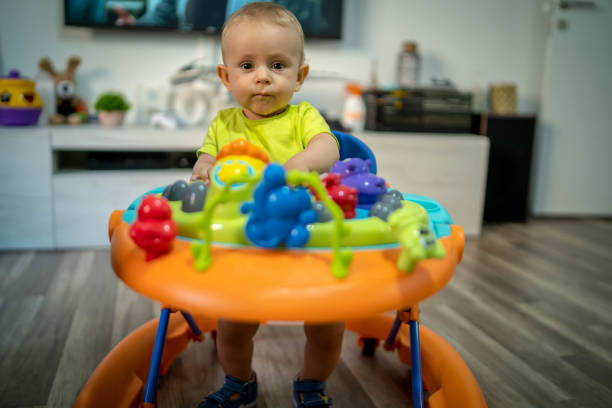 istock First steps of the boy in a baby walker 1180759361