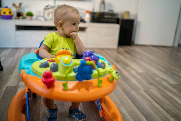 istock First steps of the boy in a baby walker 1180759395