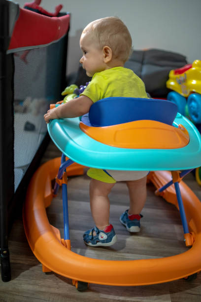 istock First steps of the boy in a baby walker 1180759424