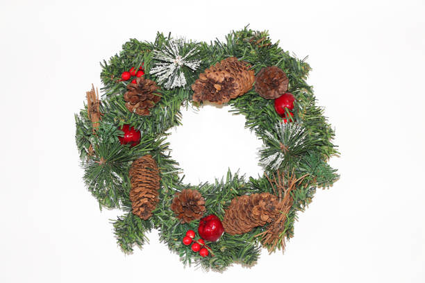 istock Artificial wreath in the form of Christmas tree branches with cones 1180760495