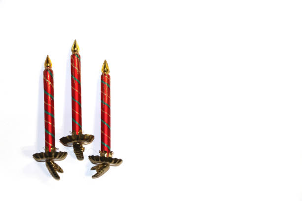 istock Three glass red-green candles on white background 1180760572