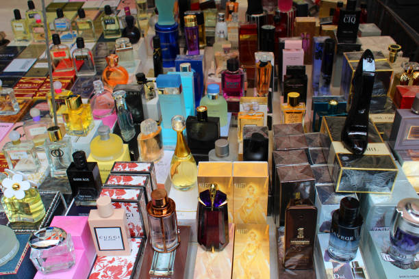 Cheap counterfeit designers perfumes on street market stall in Catania stock photo