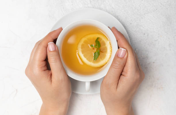 istock Woman with Herbal Tea 1180765767