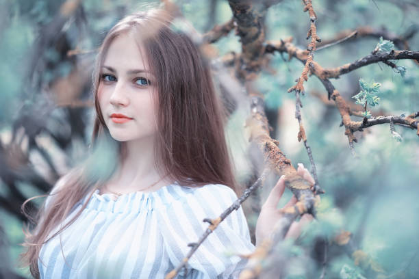 A girl in a spring green park on a walk