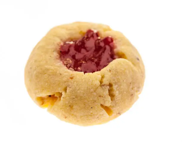 sweet food / bakery for christmas: christmas cookies: "Husarenkrapferl" Single cookie from the front on a white background
