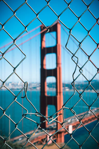 istock Iconic Golden Gate Bridge through a fence, San Francisco. 1180773551
