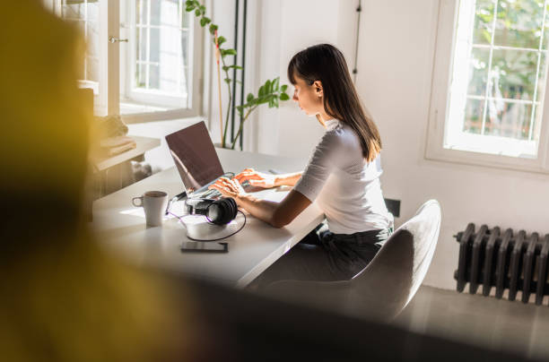 istock Beautiful businesswoman working on laptop 1180773740
