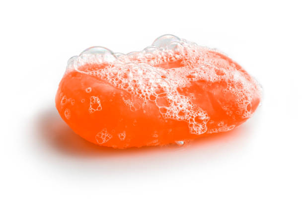 istock Orange soap bubble of isolation on a white background 1180774807