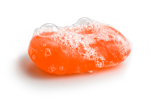 Orange soap bubble of isolation on a white background