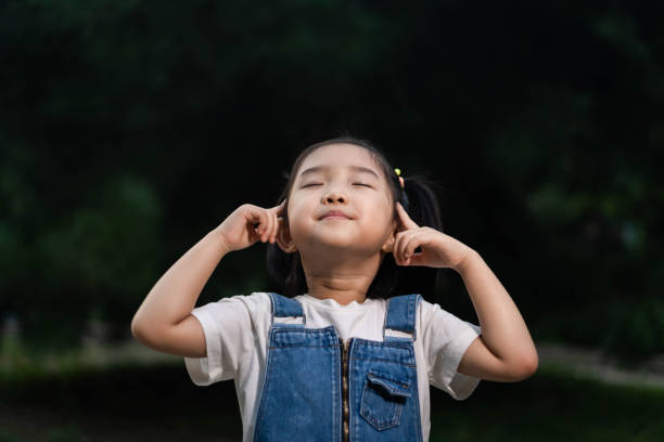 istock Cute girl meditating 1180775903
