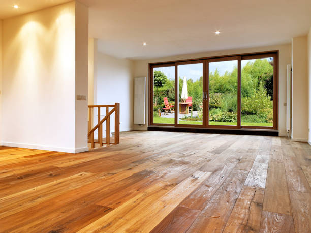 Empty big living room interior with wooden floor.