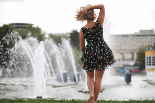 istock Beautiful girl in the summer park 1180777033