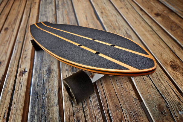 istock Dynamic view of a Black and wooden skate board 1180777631