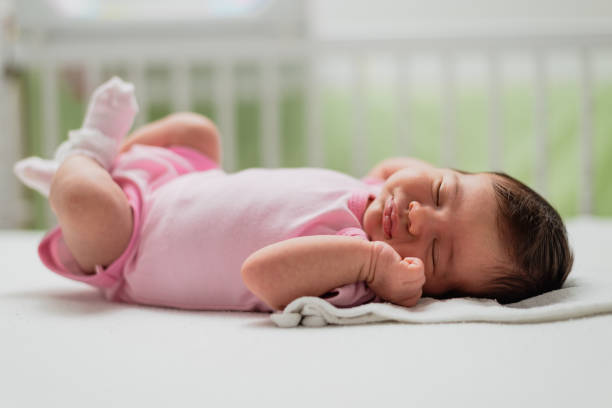 istock Sleeping newborn baby girl 1180778305