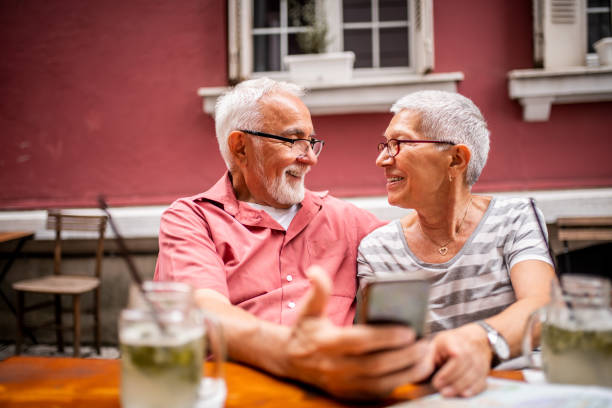 istock Senior romantic couple looking at each other 1180778454