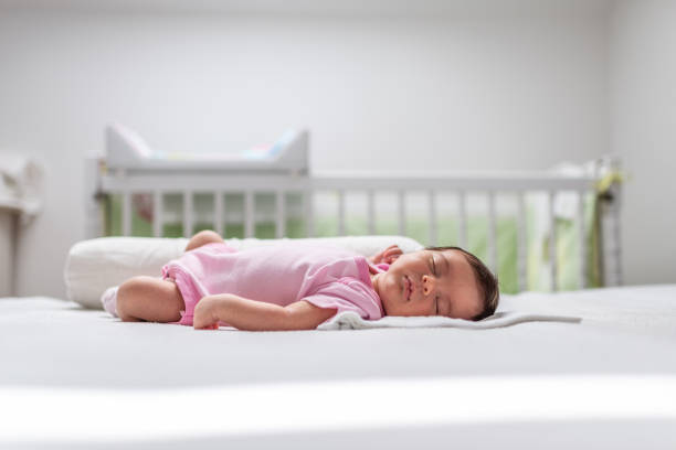 istock Sleeping newborn baby girl 1180778473
