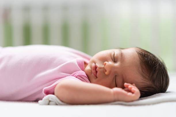 istock Sleeping newborn baby girl 1180778541