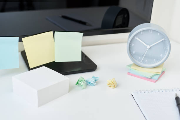 istock Modern workspace background. Workplace with a clock, office supplies and sticky notes 1180779512