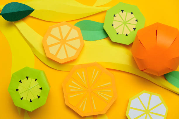 istock Fruit made of paper. Yellow background. Tropics. 1180784196